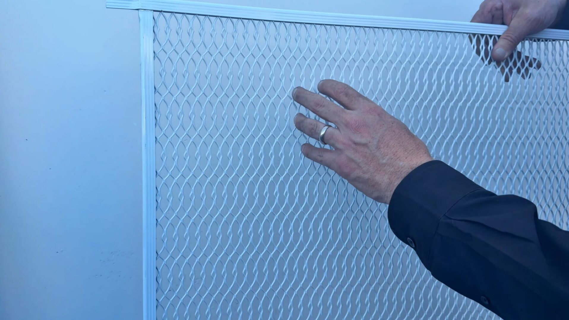 man showing big pet grille